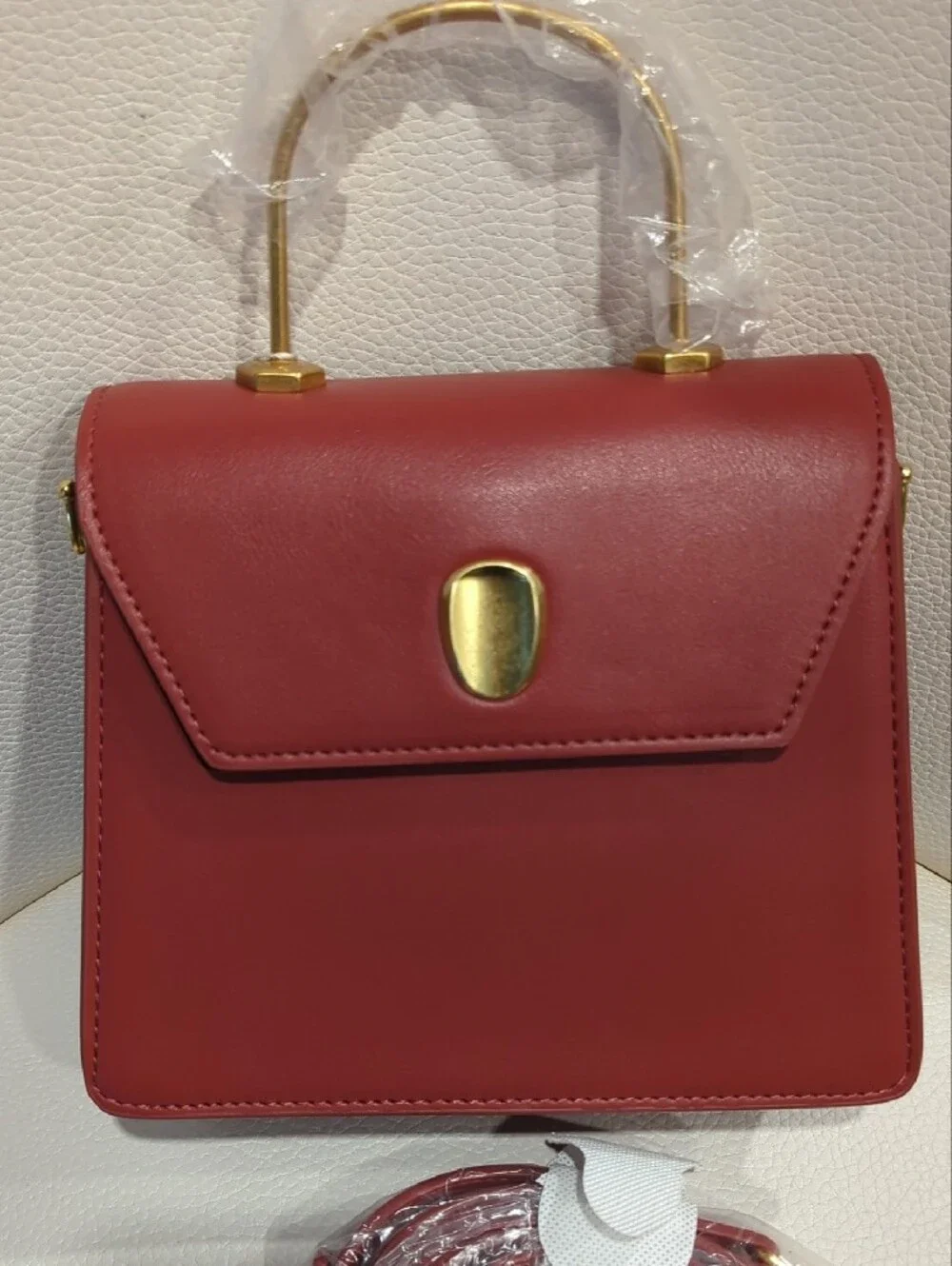 Elegant Rust Top-Handle Crossbody Bag with Gold Accent